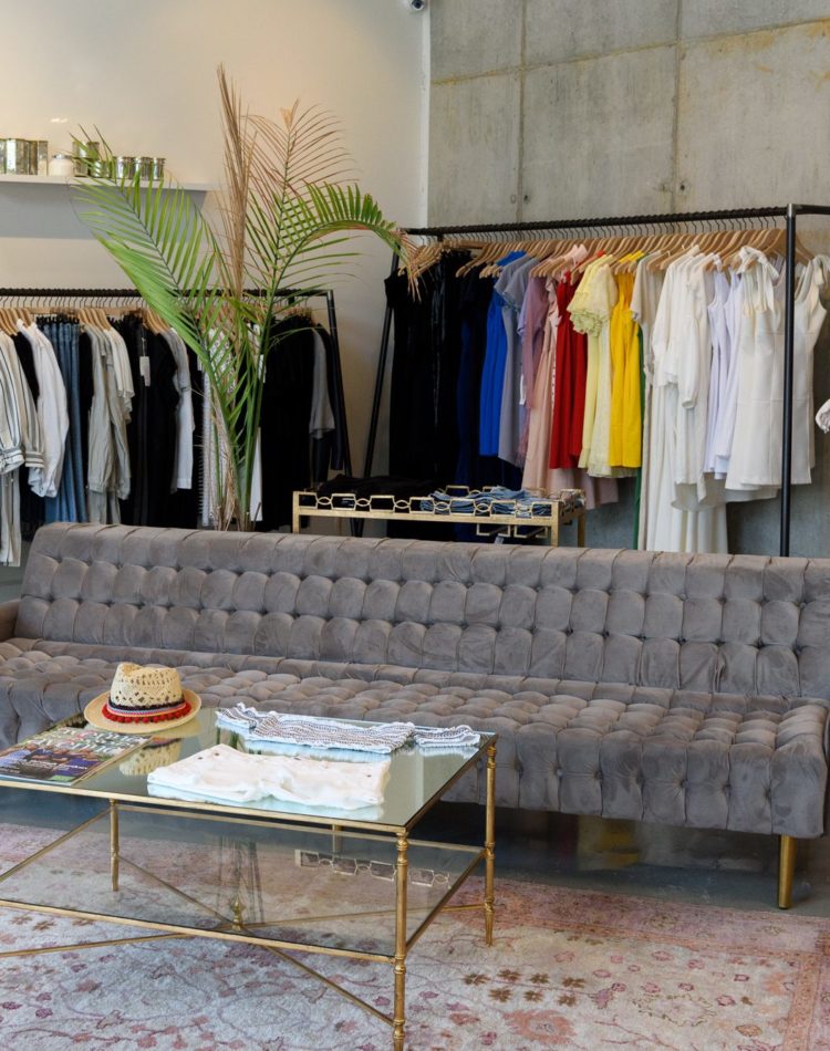 Clothing store with modern couch and coffee table