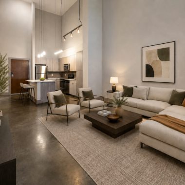 large double height loft living space with living room looking towards kitchen